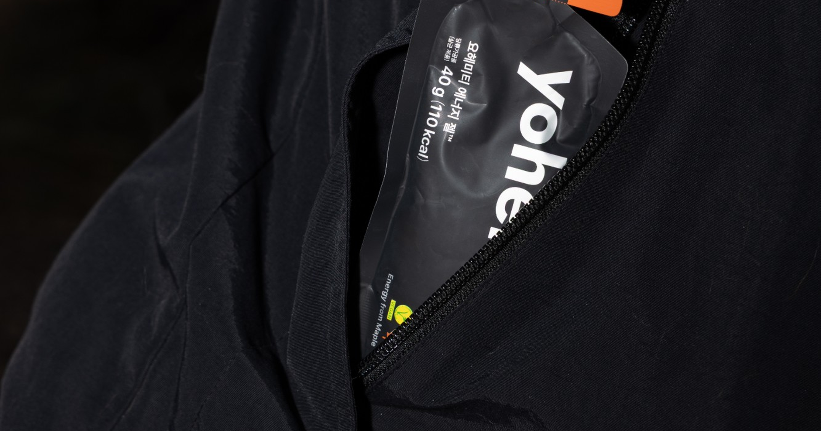 A yohemite energy gel sachet in a running jacket pocket