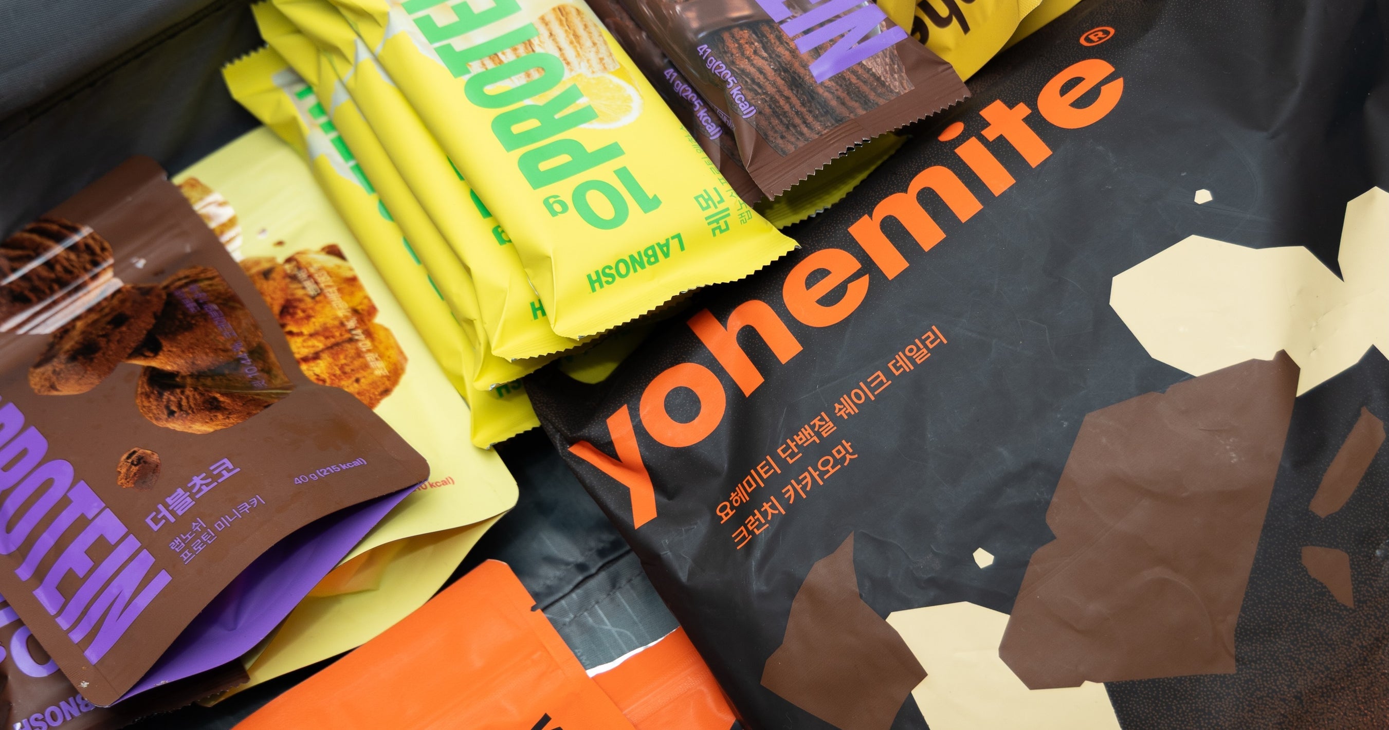 LABNOSH protein wafers and cookies with yohemite protein shakes packed in a bag