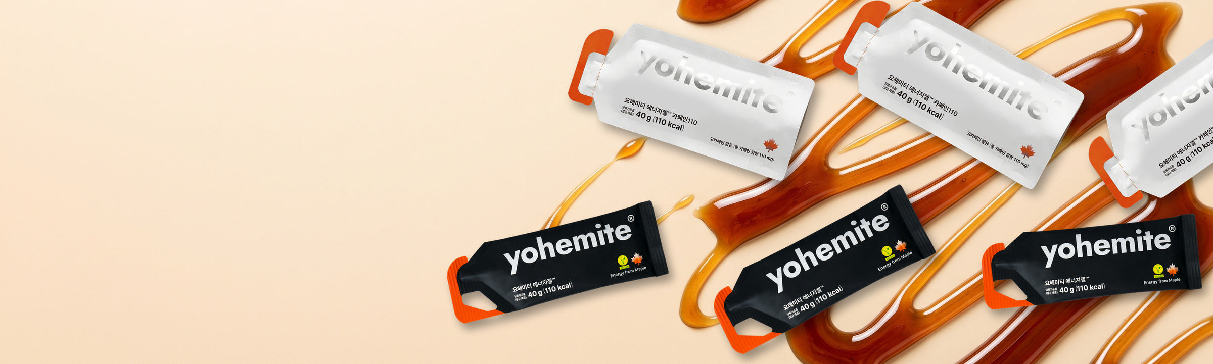 yohemite maple and Caffeine 110 energy gel sachets scattered over poured maple sap
