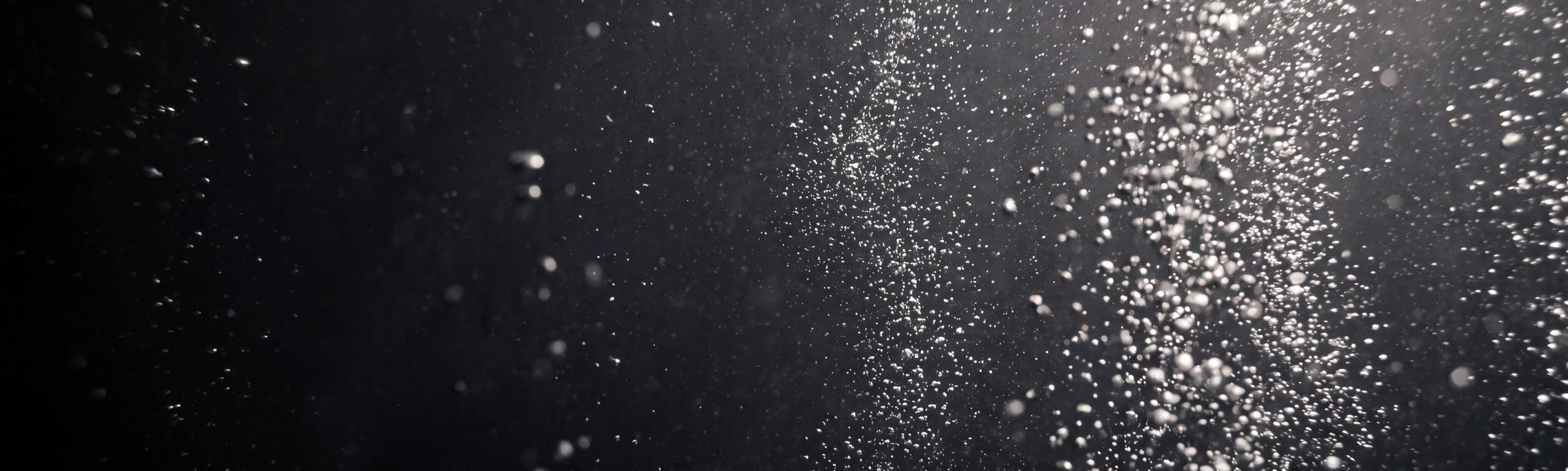 Effervescent bubbles rising through water