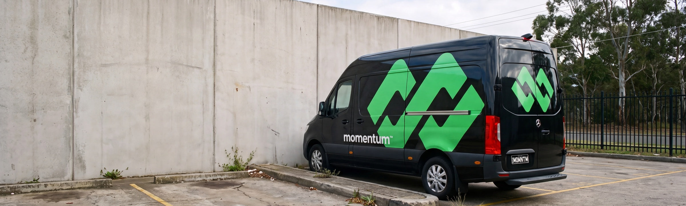A Momentum delivery van parked at the warehouse